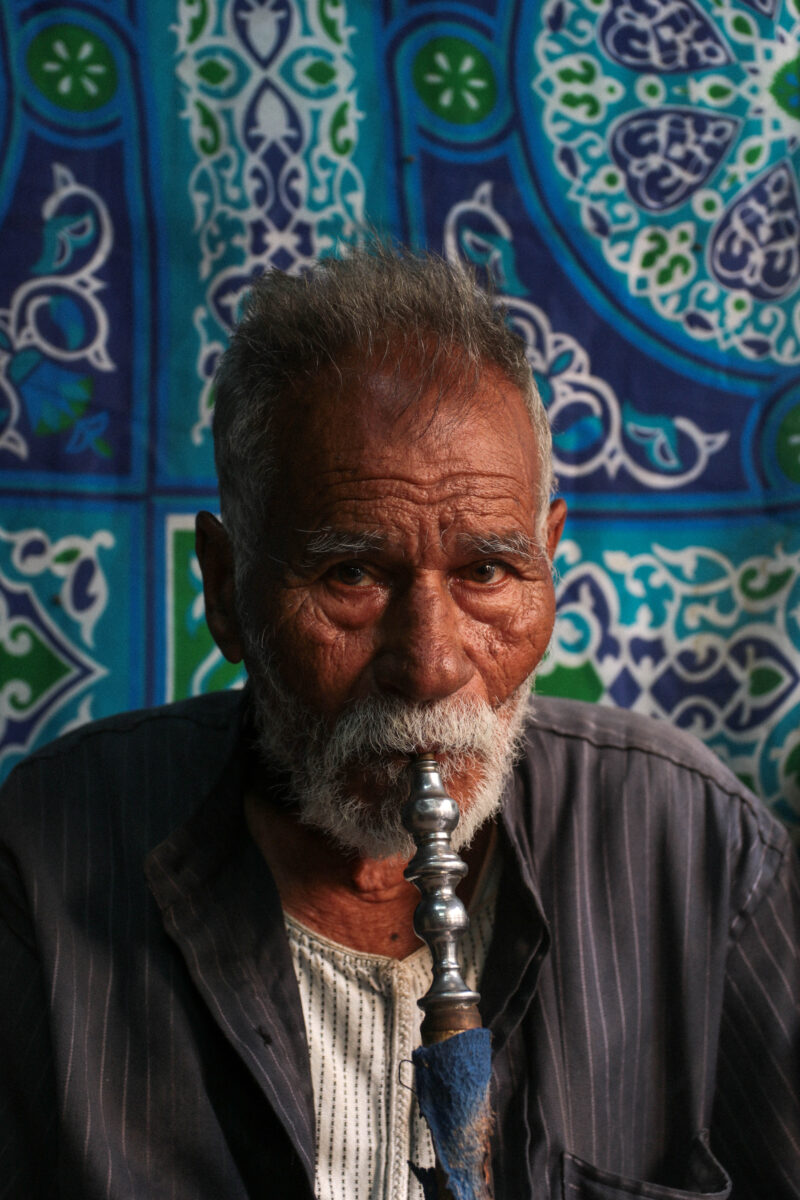 man smoking hookah