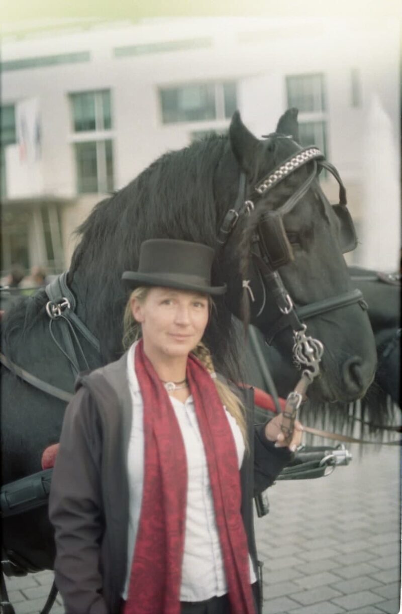 woman with black horse